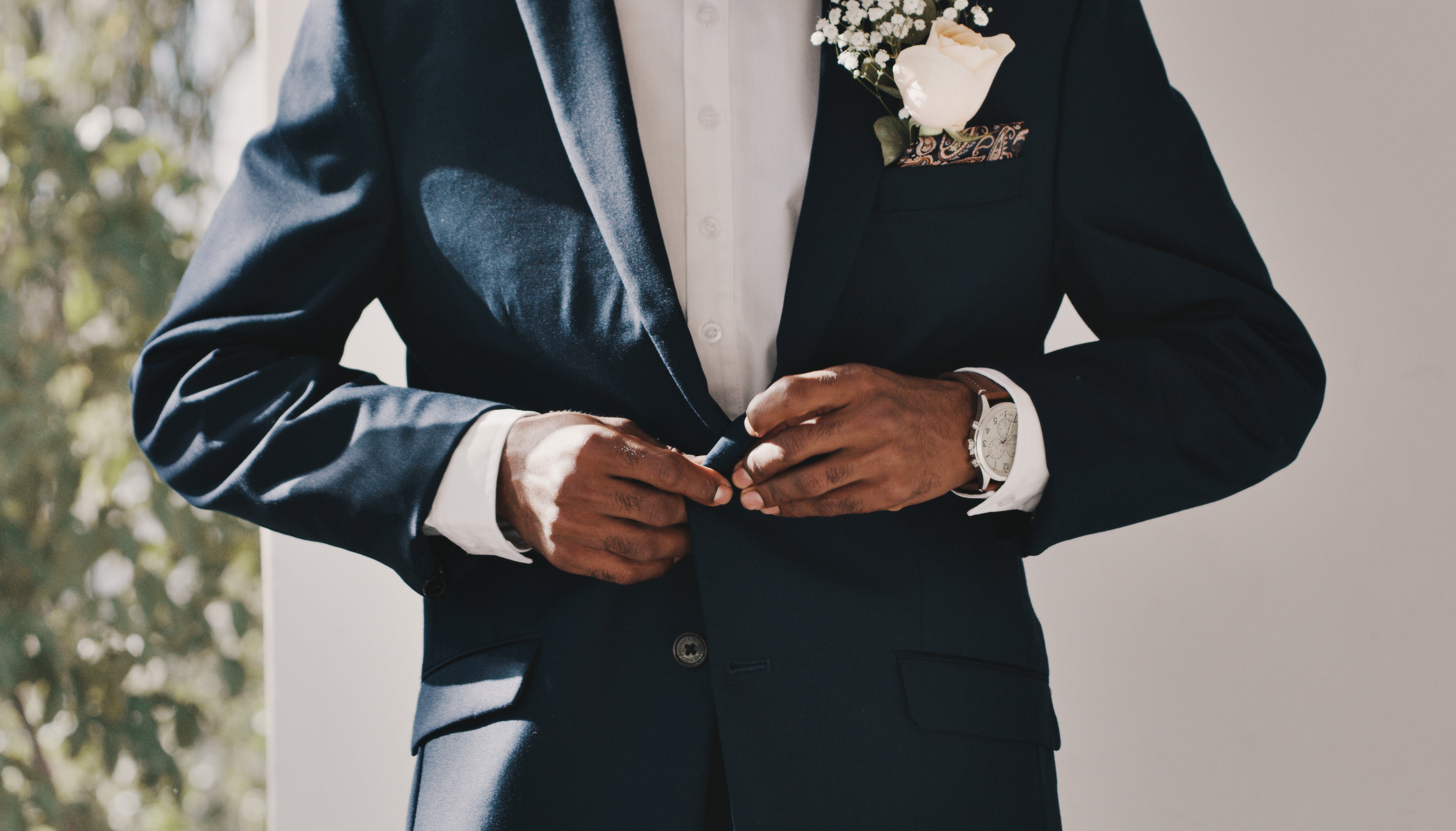 Close up image of groom's suit on wedding day