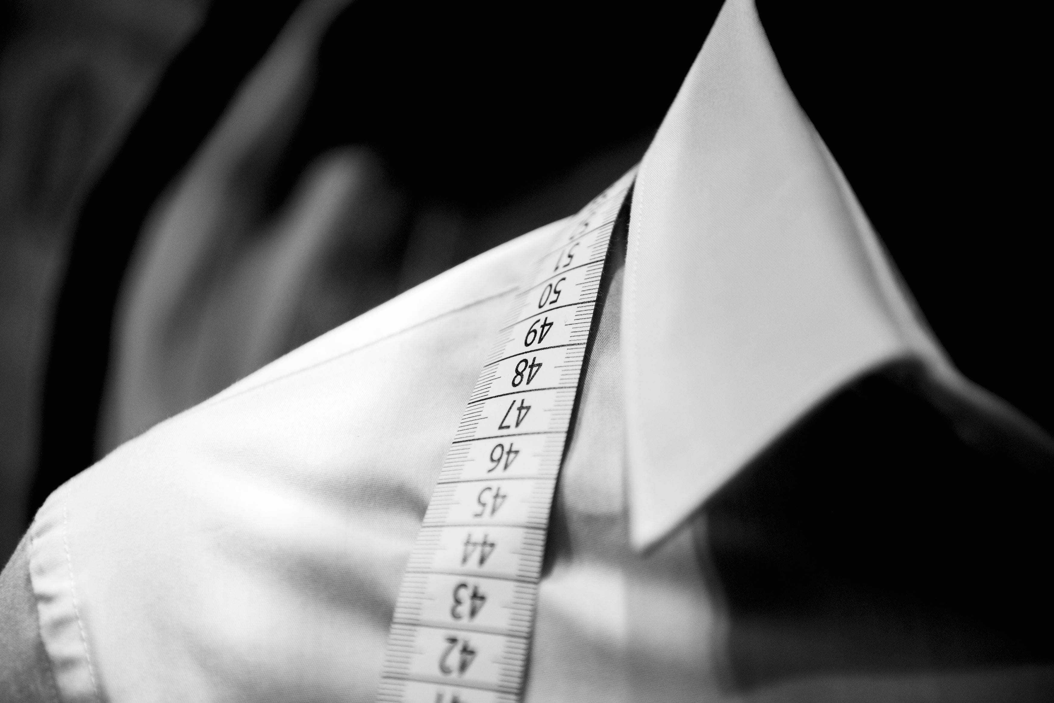 image of mens collared shirt with measuring tape