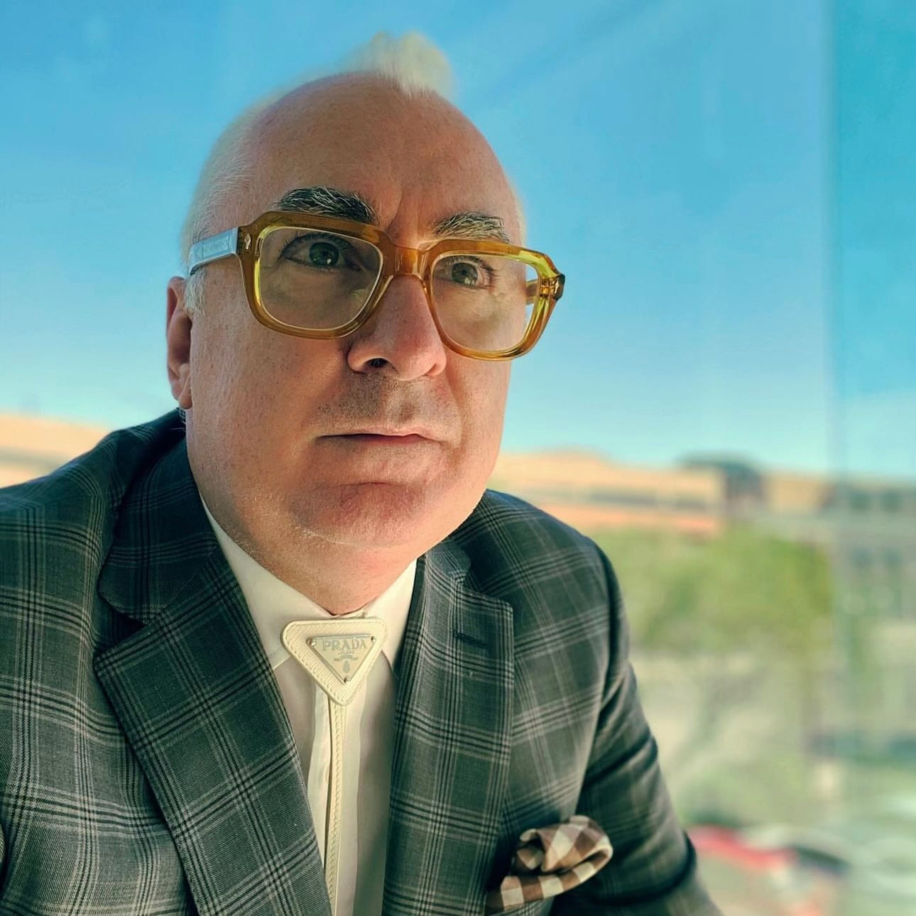 close up image of man in suit and glassees